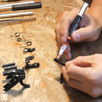 Applying 4UANTUM LUBRICANT with precision pen on firearm components for smooth operation