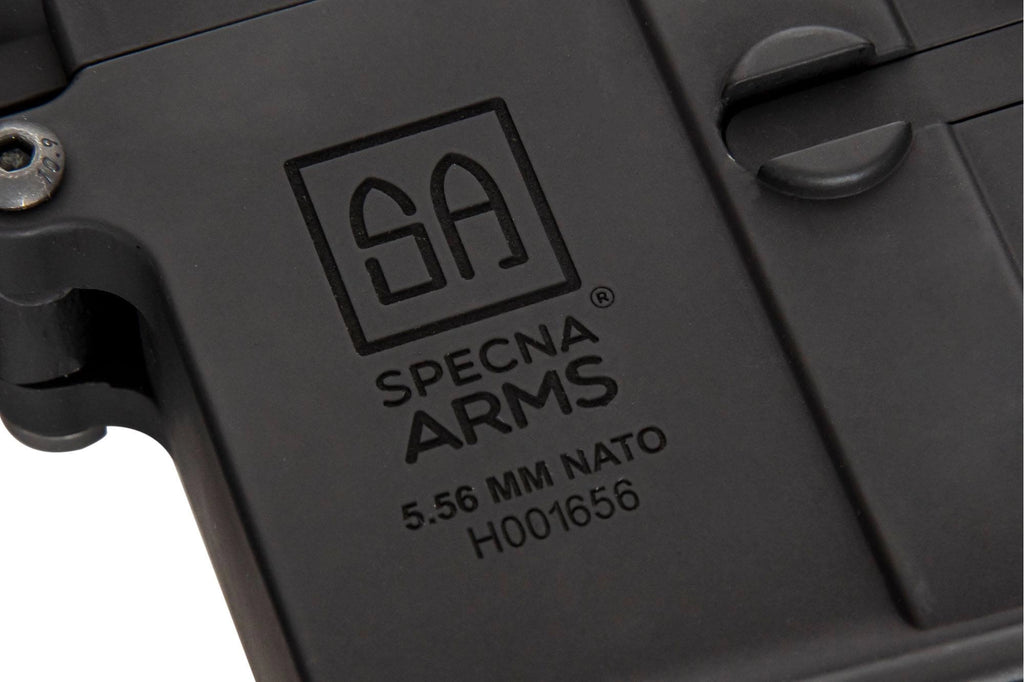 Close-up of Specna Arms product with logo and text on a black background