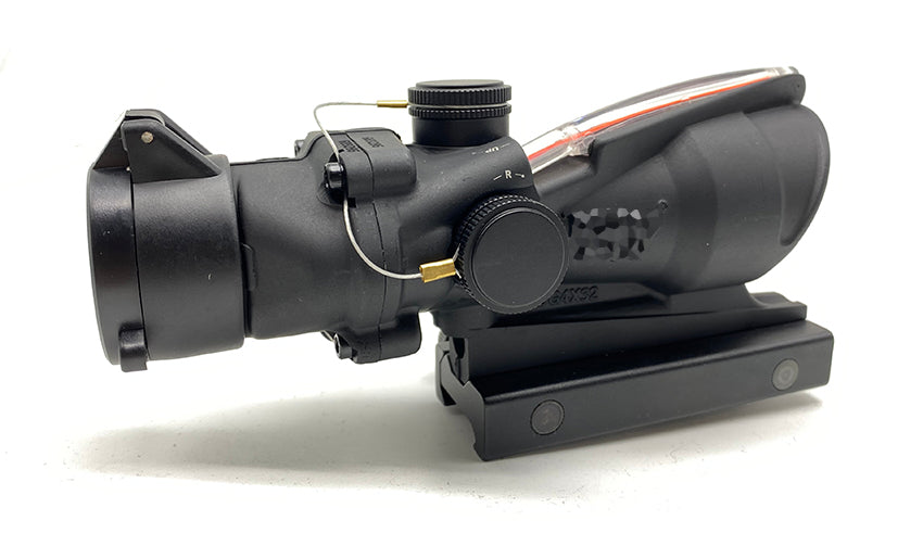 Trijicon airsoft acog accessory scope in black with adjustment knobs and mounting base