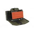 Matrix airsoft claymore explosive device in olive green with orange interior panel open