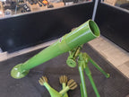 Green airsoft mortar with adjustable tripod and multiple shells for airsoft enthusiasts