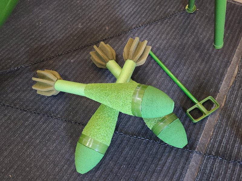 Green airsoft mortar with fins and launcher key for outdoor airsoft battles