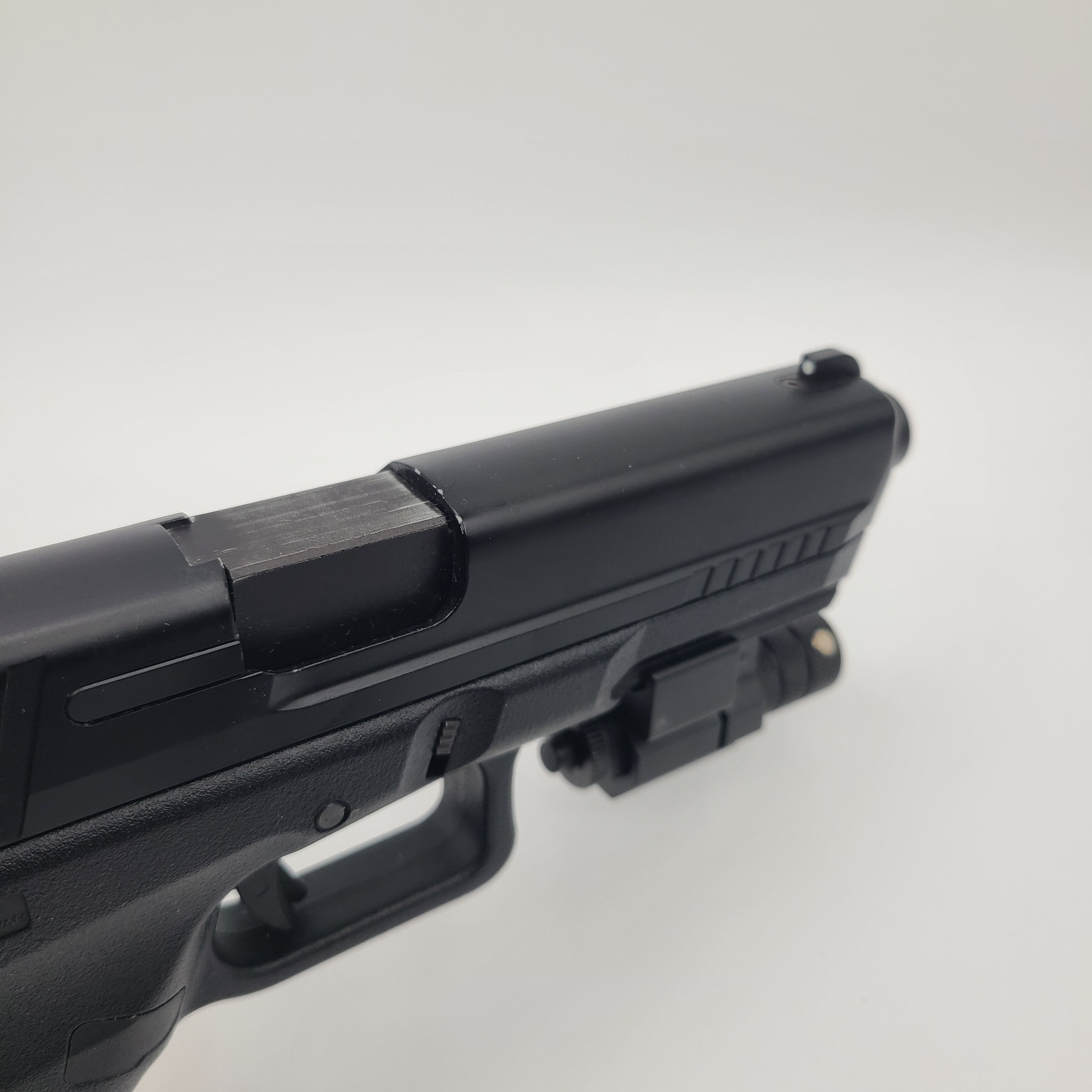 KWA airsoft pistol with tactical rail for mounting accessories and detailed design
