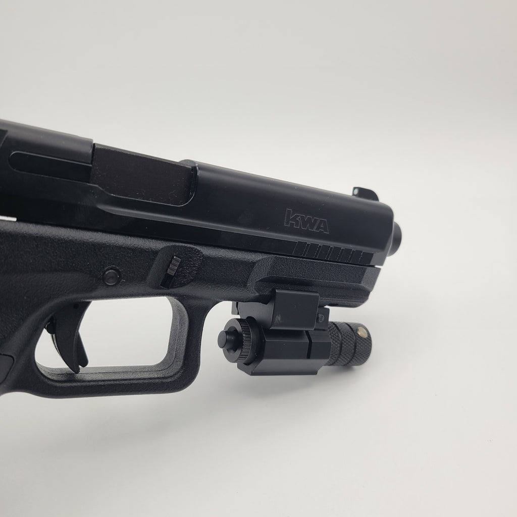 KWA airsoft pistol with tactical light attachment and black finish for enhanced gameplay
