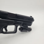 KWA airsoft pistol with tactical light attachment and black finish for enhanced gameplay