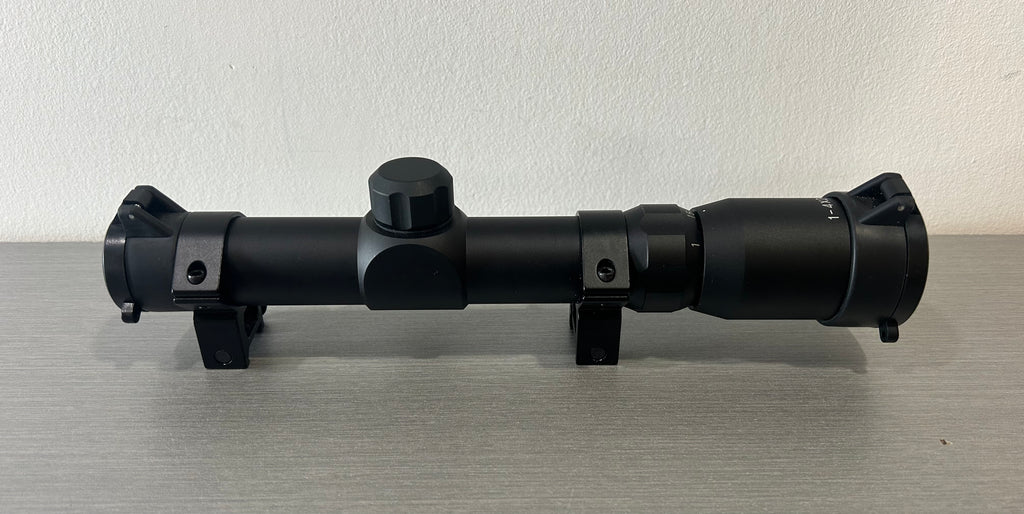 Black airsoft scope with adjustable magnification and durable mounting rings for precision targeting