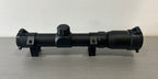 Black airsoft scope with adjustable magnification and durable mounting rings for precision targeting