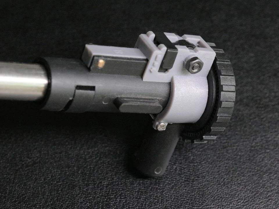 Close-up of AIRTECH conversion kwa component showing detailed mechanical parts on black background