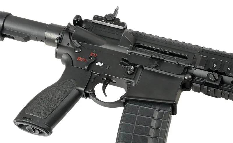 Close-up view of ARCTURUS GR16 AEG AIRSOFT rifle showing trigger, grip, and magazine details
