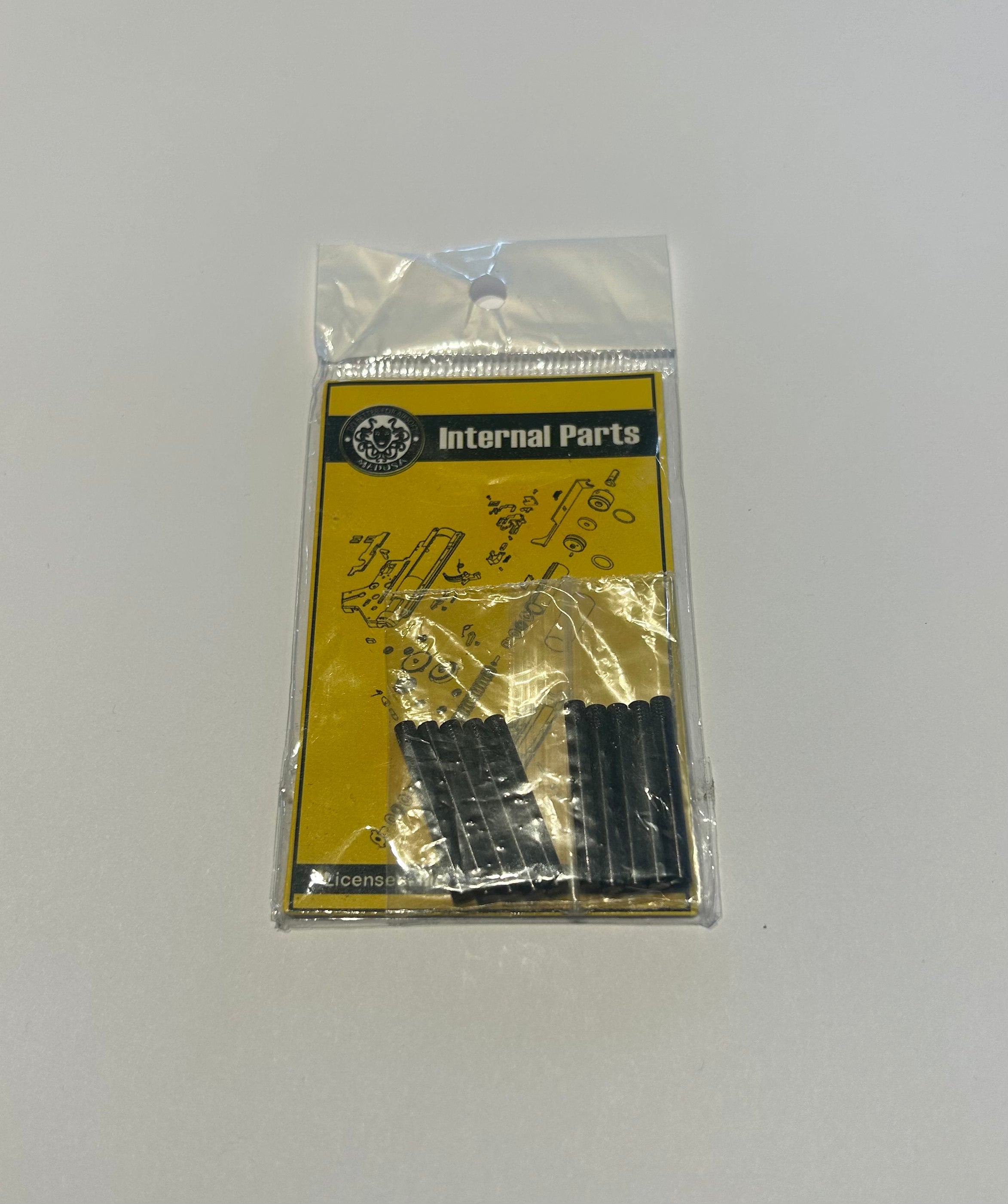MEDUSA body pin aeg airsoft internal parts in clear plastic packaging with yellow label