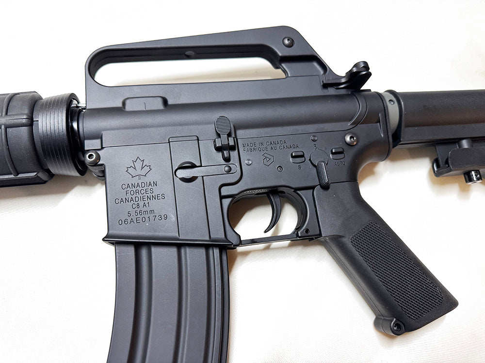 Detailed view of C8 Airsoft rifle with ergonomic grip and Canadian Forces markings