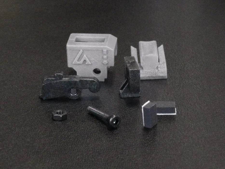 Conversion kit airtech with small metal and plastic components on black background