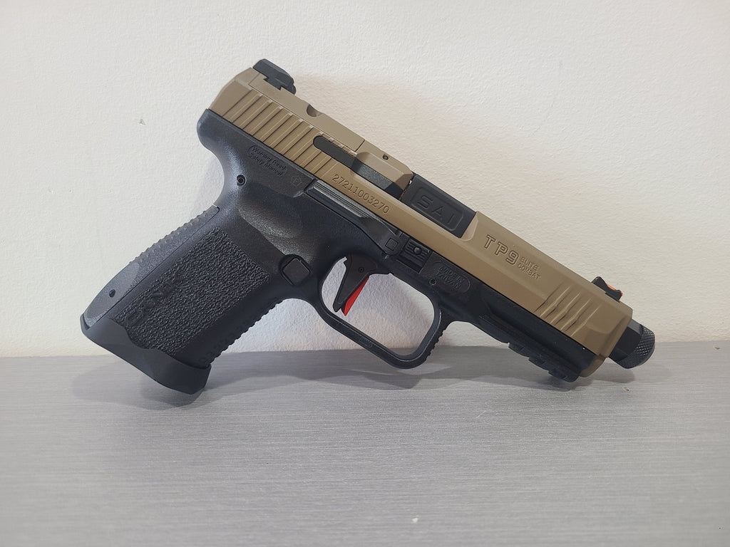 CYBERGUN CANIK TP9 TAN GBB AIRSOFT pistol with tan slide and black textured grip on gray surface