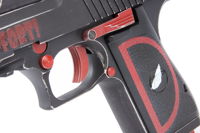 Close-up of Deadpool airsoft pistol with distinctive red and black design featuring Deadpool logo