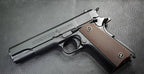 E&C M1911 A1 GOVERNMENTAL semi-automatic pistol with a matte black finish and textured grip