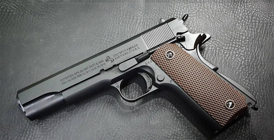 E&C M1911 A1 GOVERNMENTAL semi-automatic pistol with a matte black finish and textured grip
