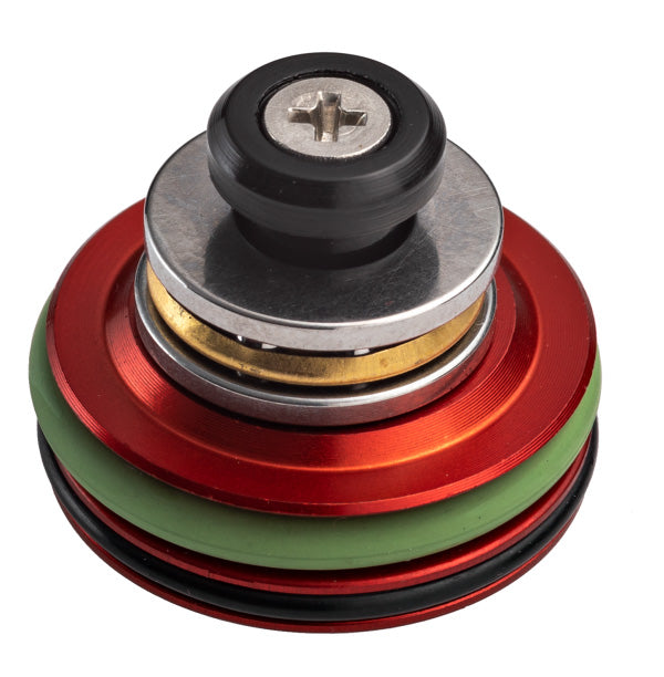 FPSSOFTAIR INTERNE part FPS SOFTAIR PISTON in red, green, and silver metal with rubber seals
