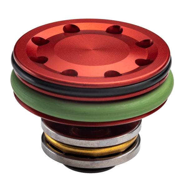Close-up of FPS SOFTAIR PISTON red and green internal airsoft gun part with metal components