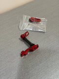 IPSC RED CHARGING BUTTON and accessories displayed with installation components for firearm enhancements
