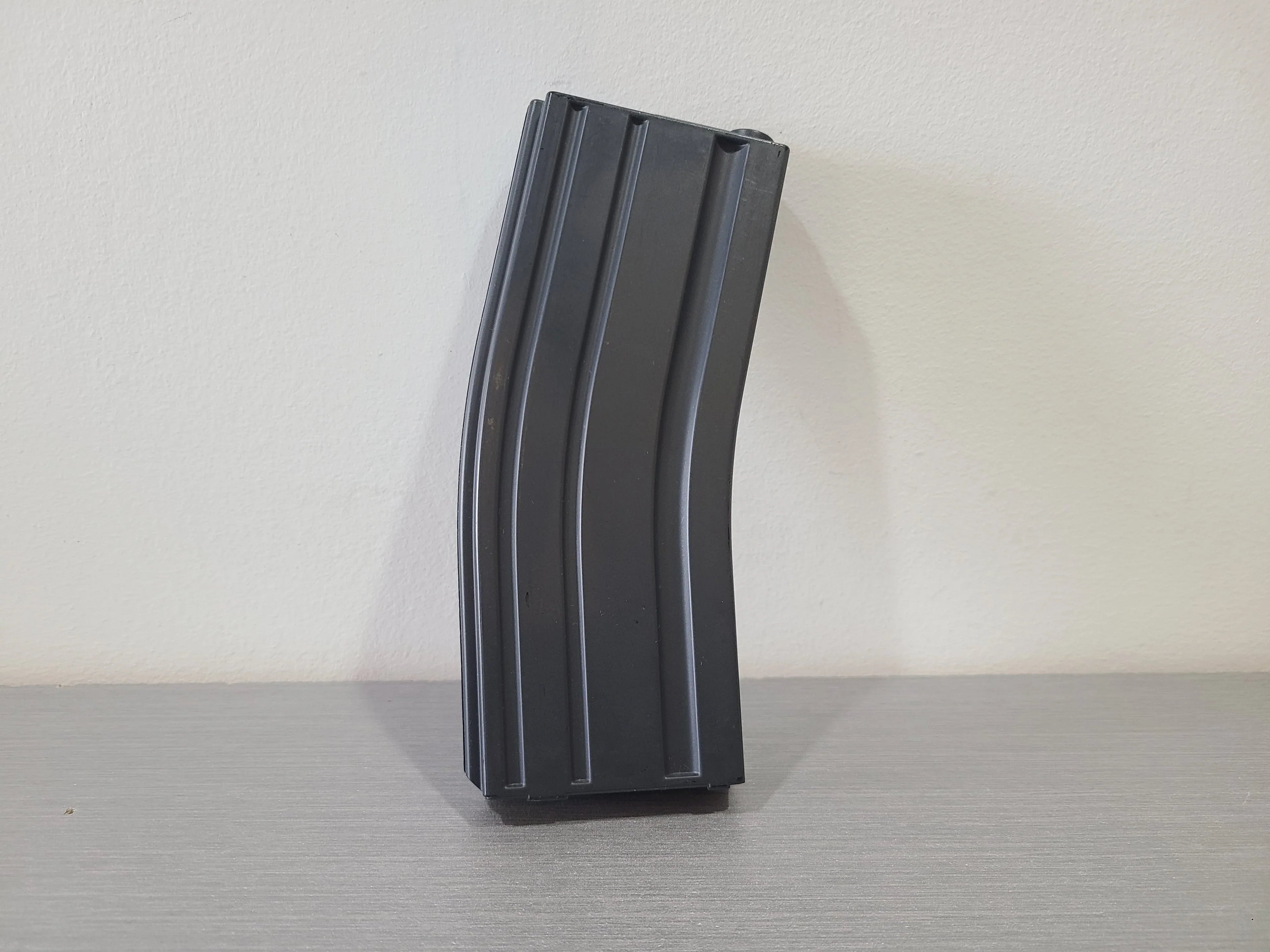 District Airsoft M4 airsoft magazine in black designed for high-capacity shooting