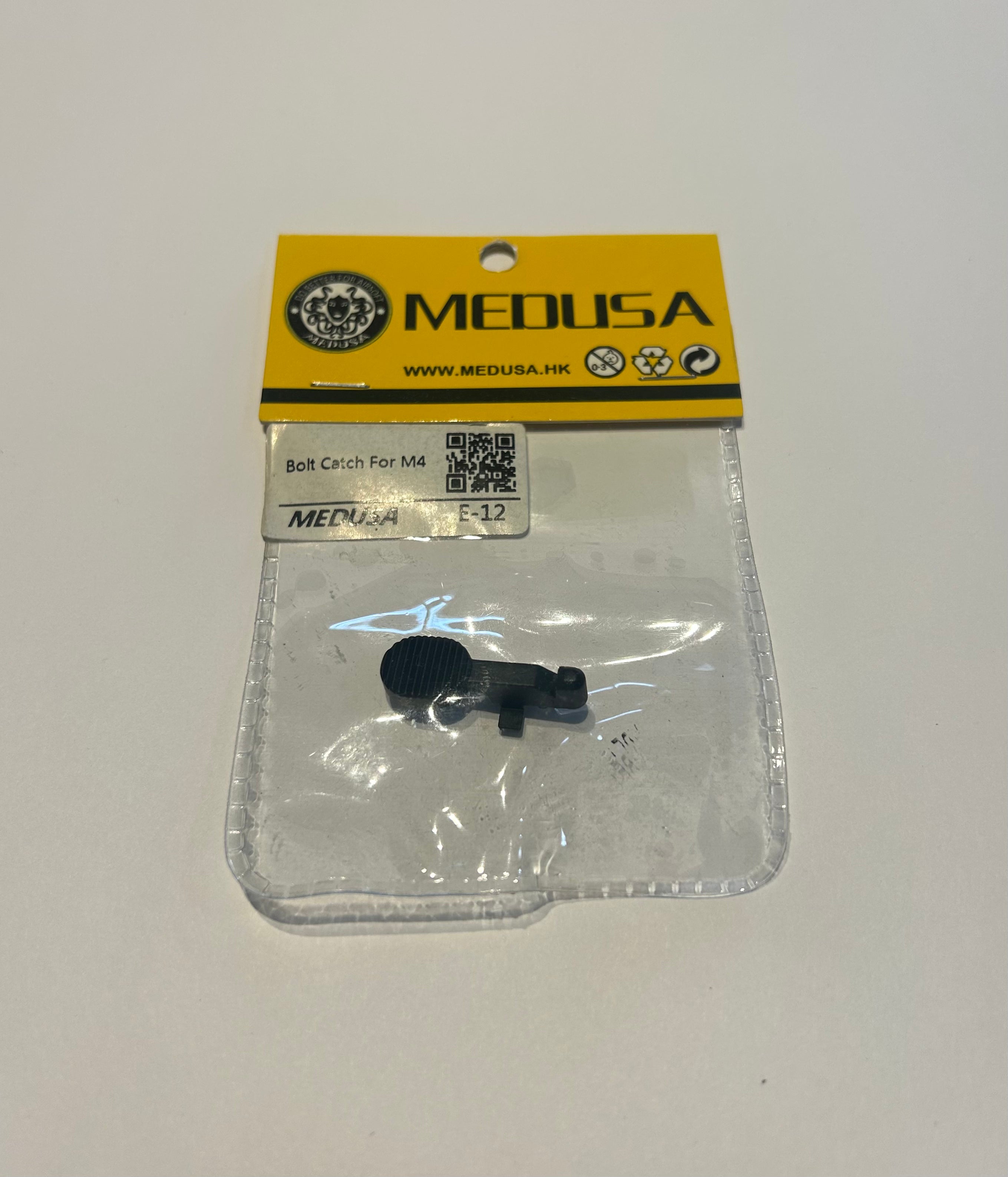 MEDUSA bolt catch m4 airsoft in clear plastic packaging with yellow MEDUSA label