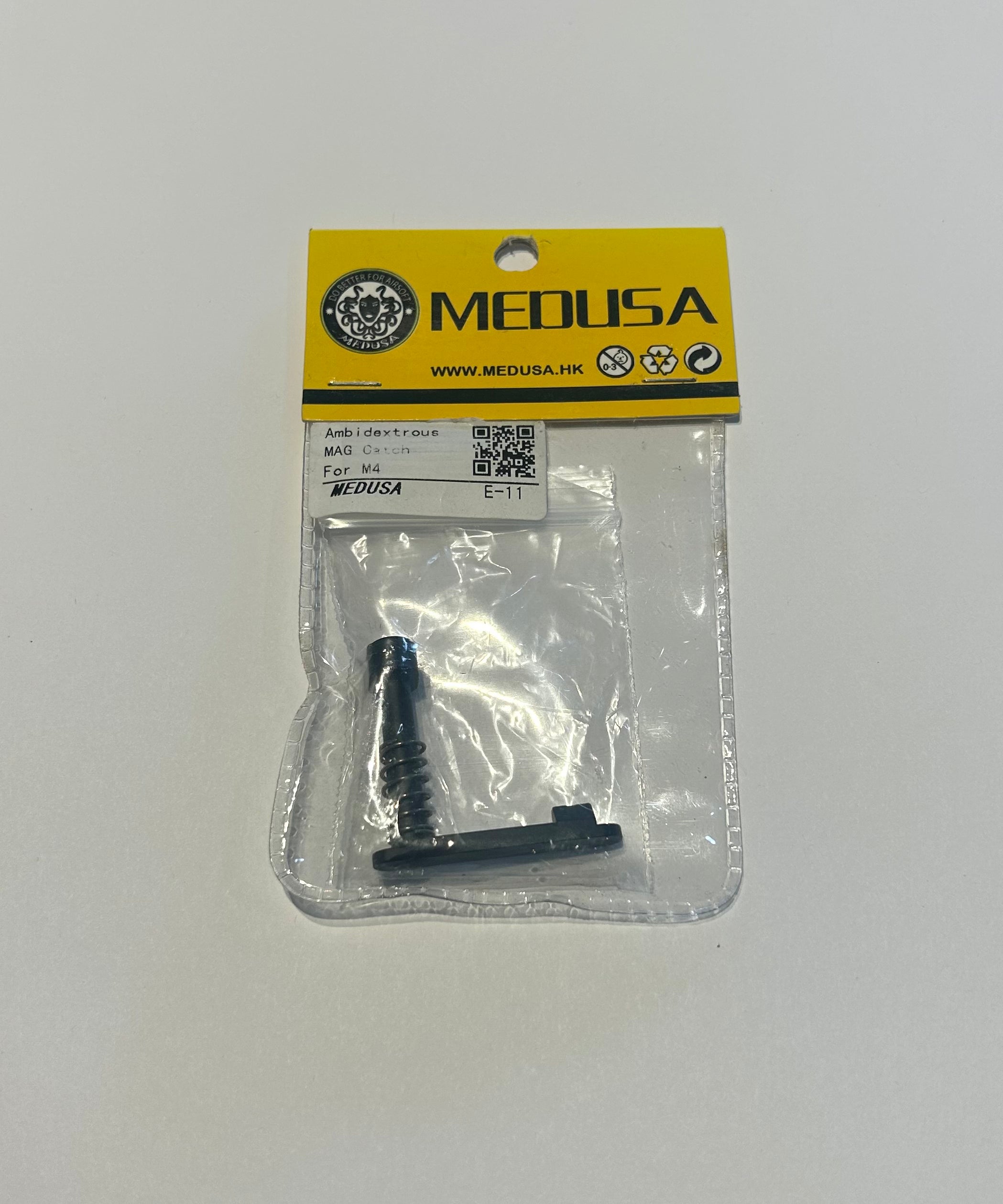 MEDUSA magazin catch m4 airsoft external part in clear packaging with yellow label