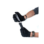 Hands in tactical gloves filling an airsoft magazine using Novritsch reusable gas reservoir