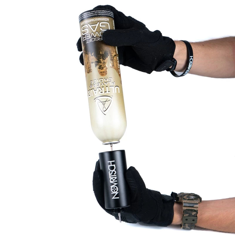 Gloved hands attaching a gas bottle to a black Novritsch reusable gas reservoir adapter for airsoft use
