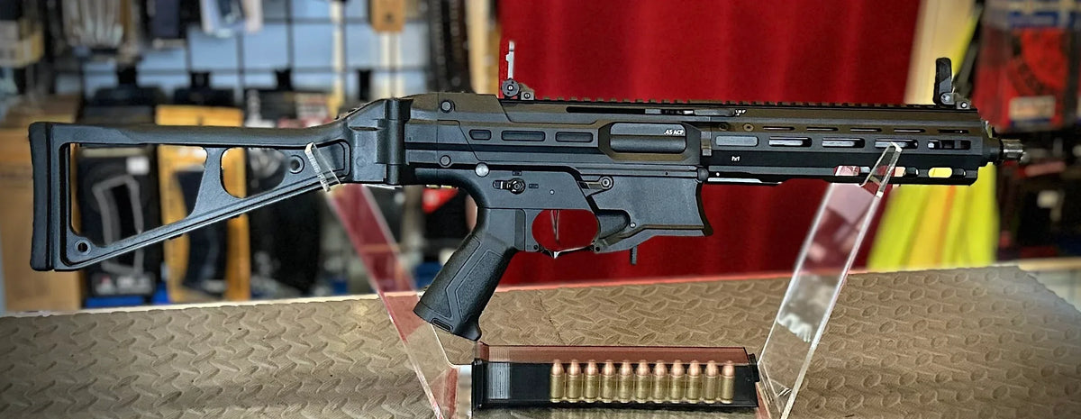 G&G PCC445 airsoft gun displayed on a stand with a magazine showcasing its sleek design