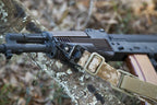 DISTRICT AIRSOFT Quick Detach Belt Buckle attached to a tactical sling on an airsoft rifle