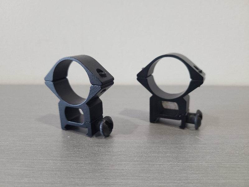 Black scope ring 30mm set for airsoft accessories by District Airsoft on gray surface