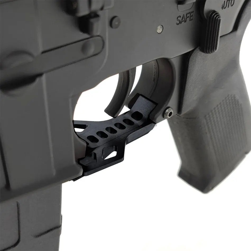 Close-up of GRIDLOK PDW AEG AIRSOFT trigger and grip area showing detailed black design
