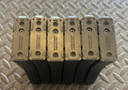 Six Tokyo Marui MWS GBBR mag magazines stacked with metal bases for airsoft enthusiasts