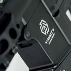 Close-up of AEG body featuring TRINITY ARMAMENT logo and detailed design elements