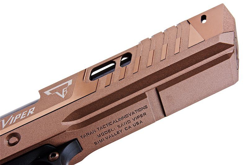 Close-up of ARMY ARMAMENT pistol tti sand viper in tan color with detailed engraving